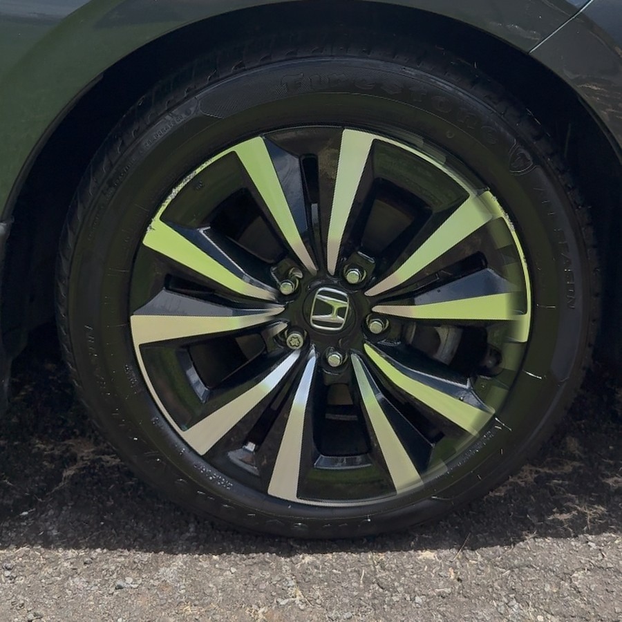 Wheel after Pacific Auto Shine detail — mirror clean