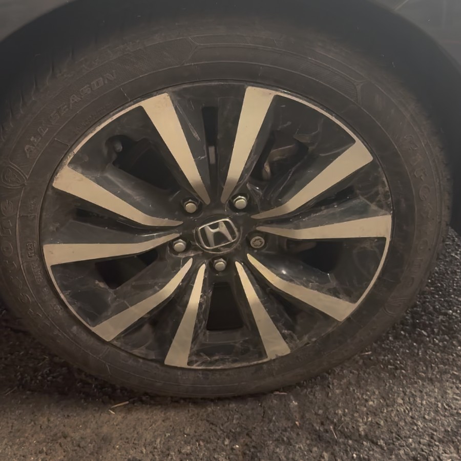 Same wheel before the detail — covered in brake dust